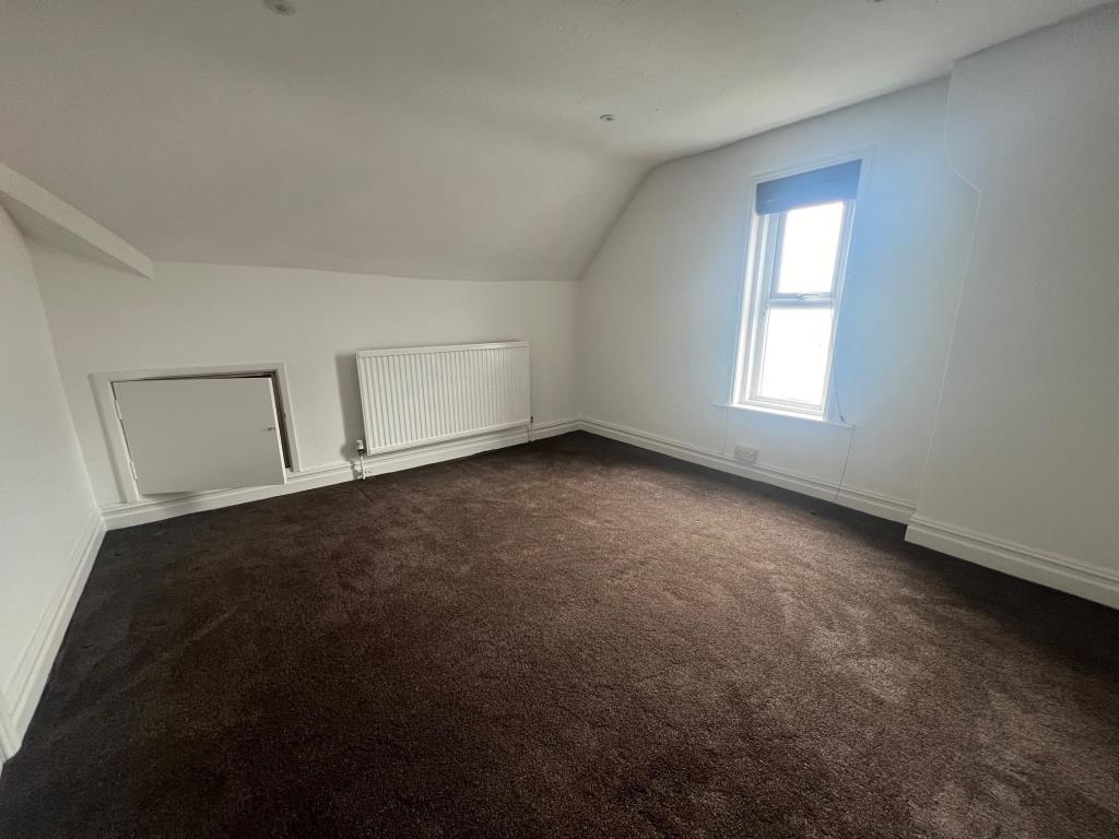 Lot: 32 - RECENTLY REFURBISHED FLAT - Bedroom with white painted walls and brown carpet